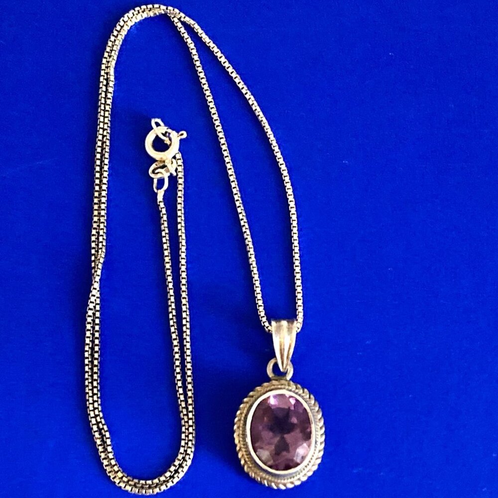 Faceted amethyst pendant with sterling silver setting and chain